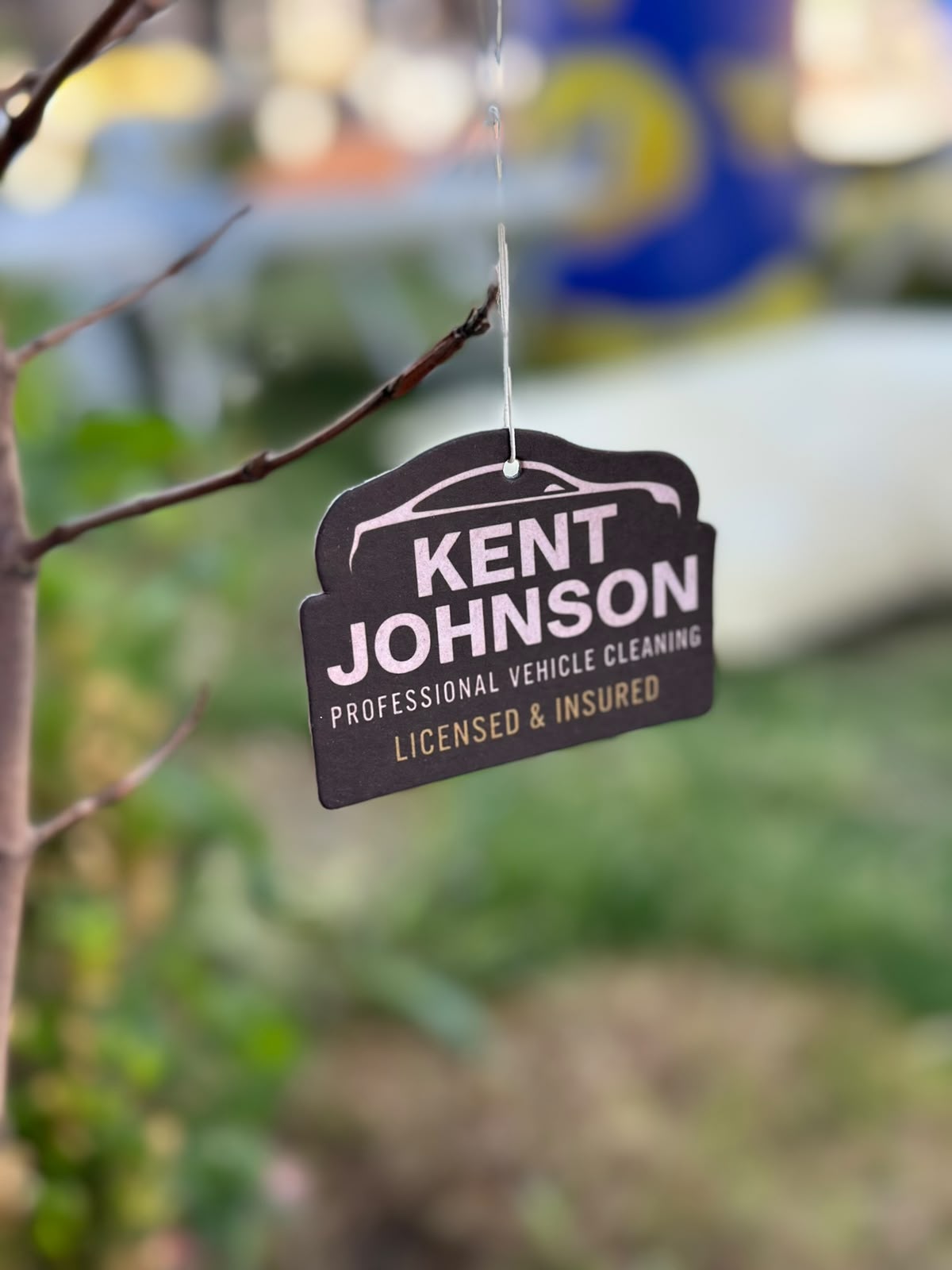Custom-shaped air freshener with logo outdoors